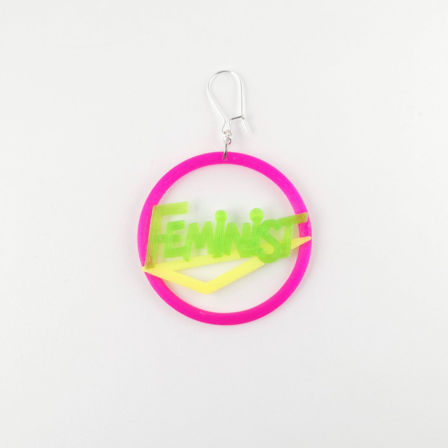 80's feminist earring in bright neon pink, green and yellow