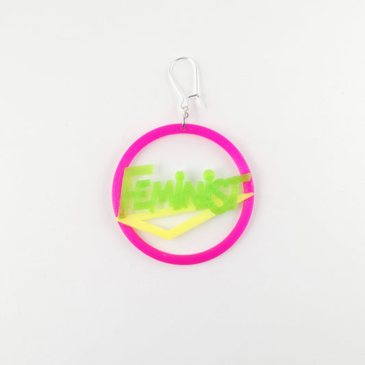 80's feminist earring in bright neon pink, green and yellow