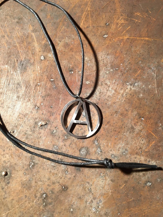 An anarchist sign in a faux leather lace